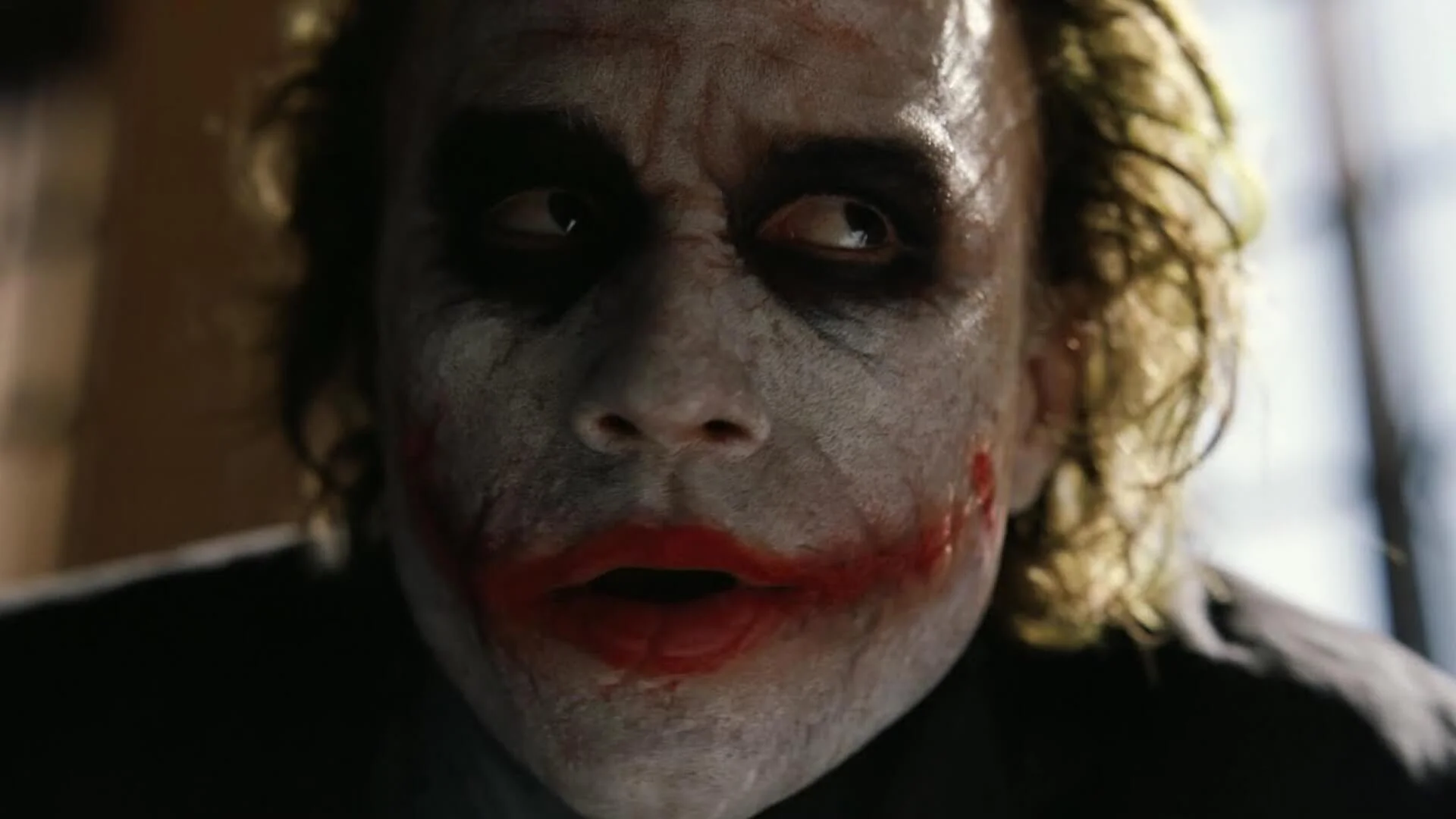 How to Design Shot Lists Like Christopher Nolan - Closeup Joker Dark Knight - StudioBinder