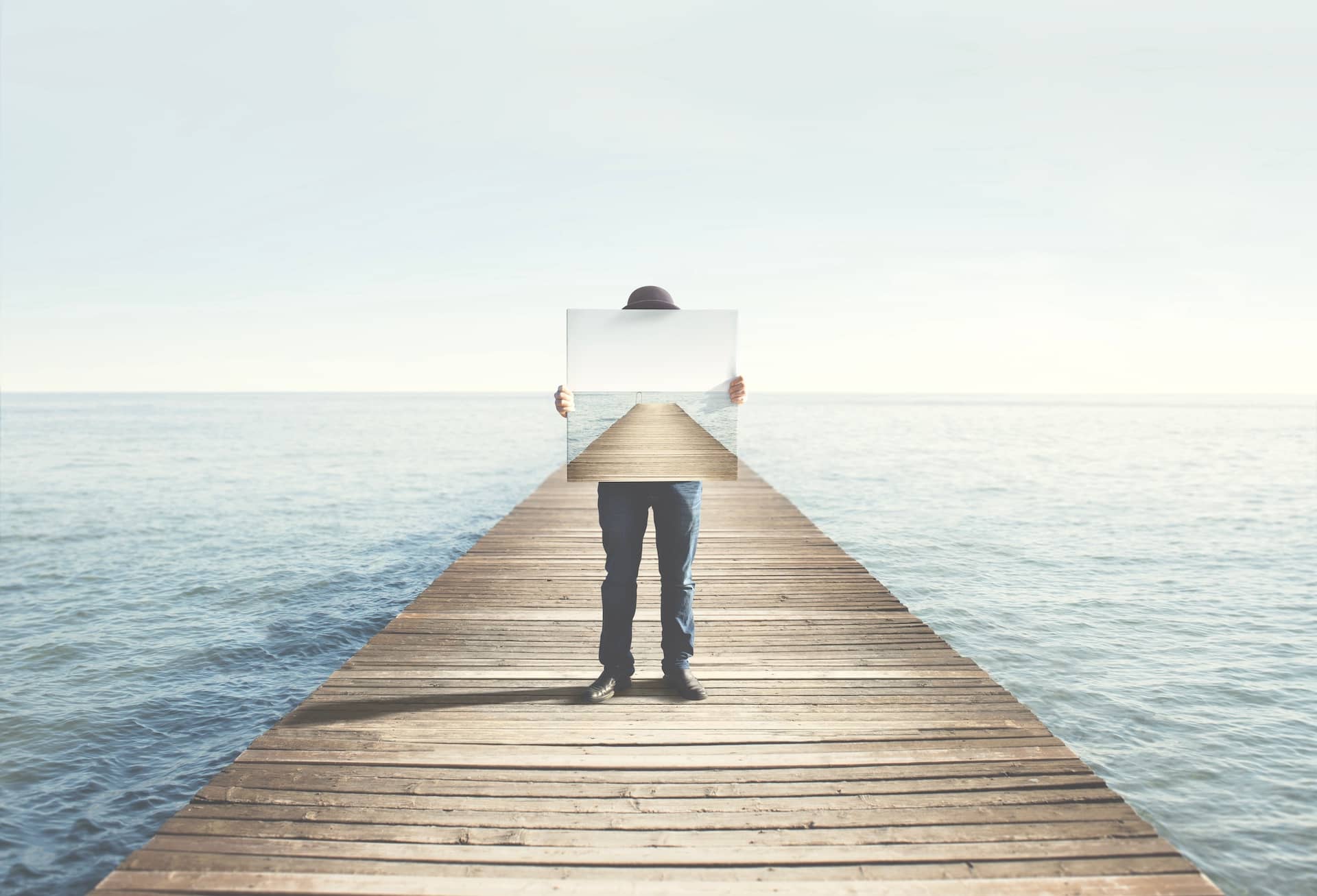 Conceptual Photography Man Holding Surreal Painting of Boardwalk
