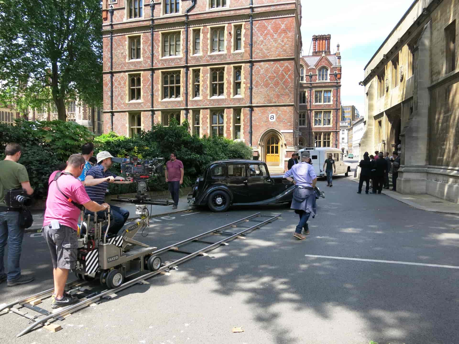 Key Grip in Film Crew Build Dolly Tracks with Dolly Grip