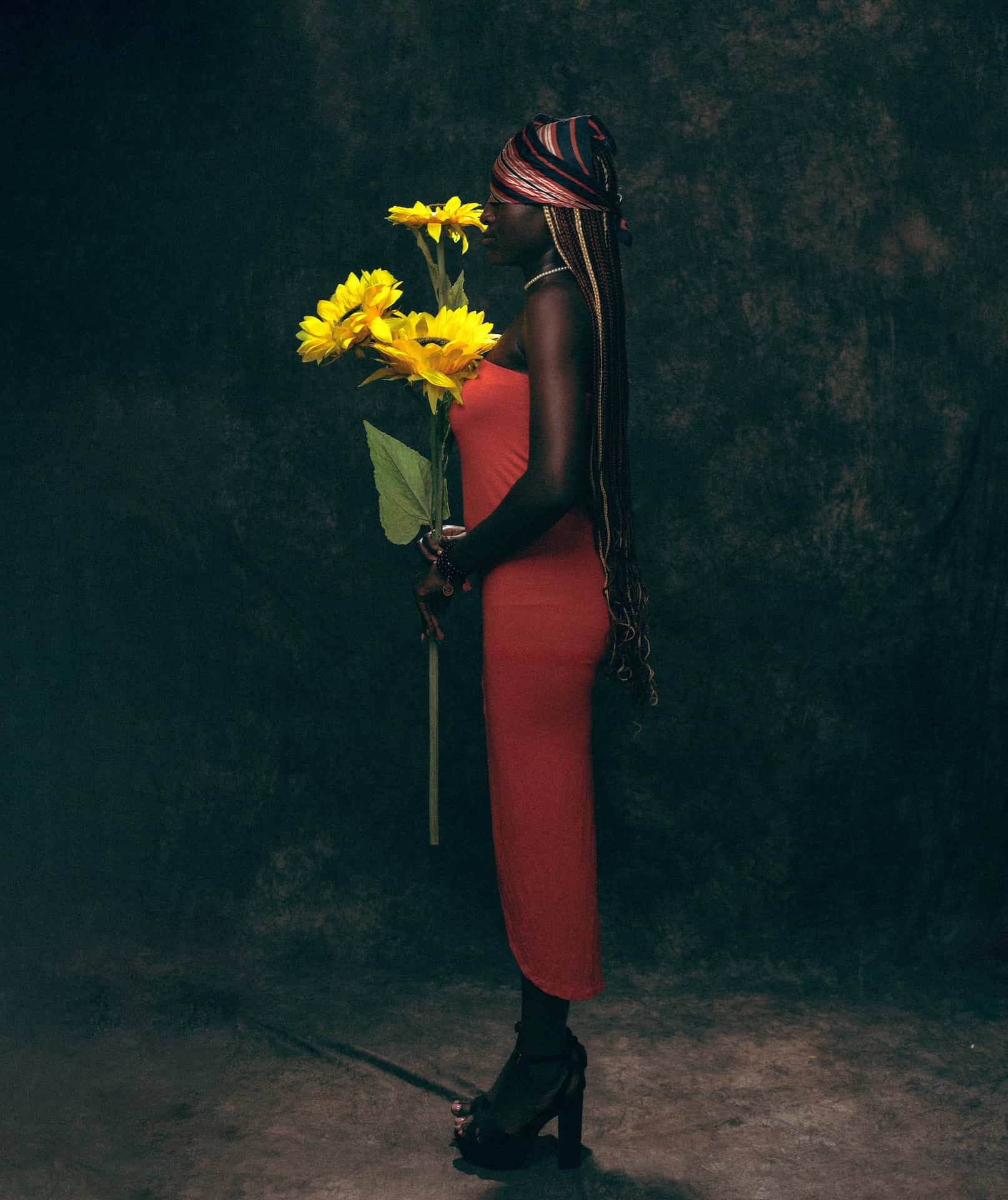 What is fine art photography Woman holding sunflowers
