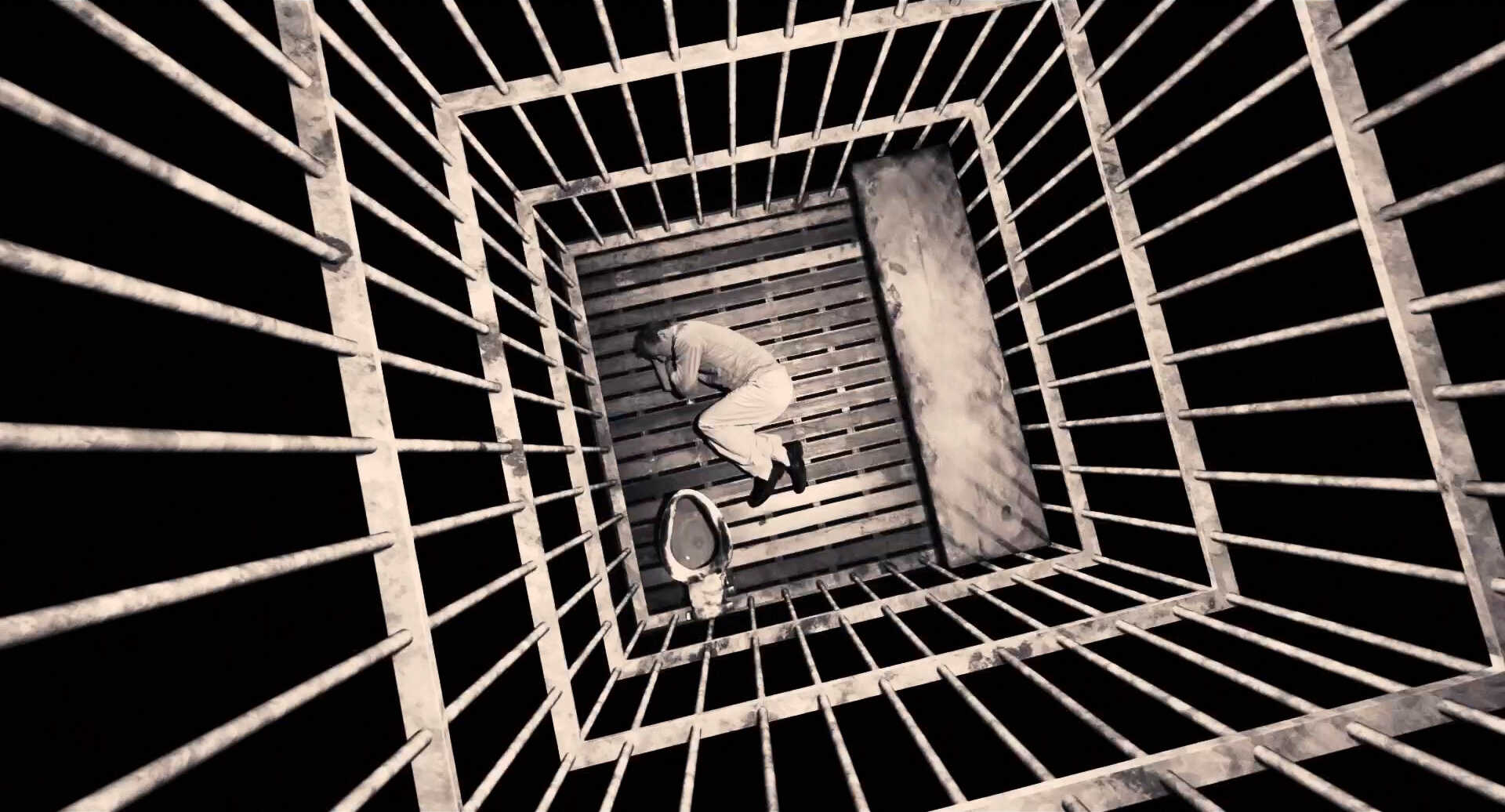 Dutch Angle Shot Example Dutch camera angle on a person in a cage from Sin City