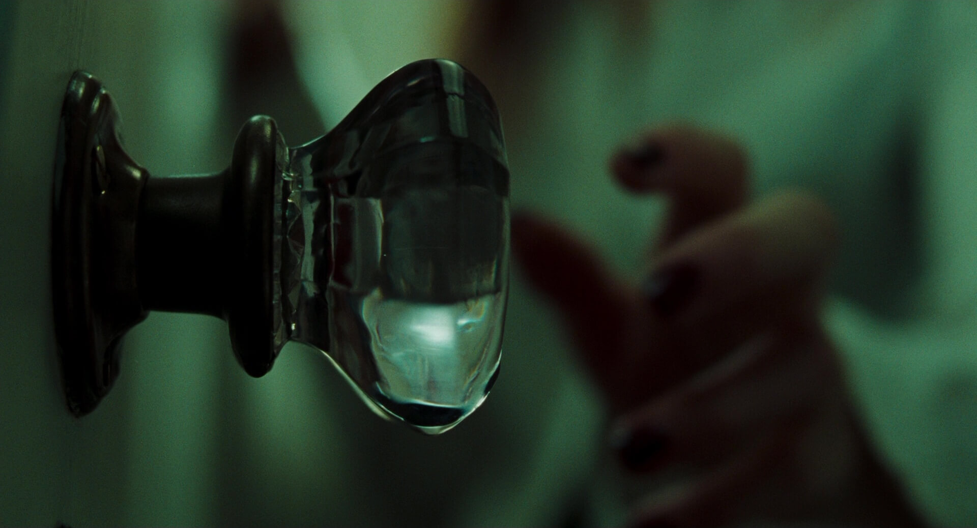 Extreme Close Up Shot Example ECU of a hand reaching out to a door knob from The Room