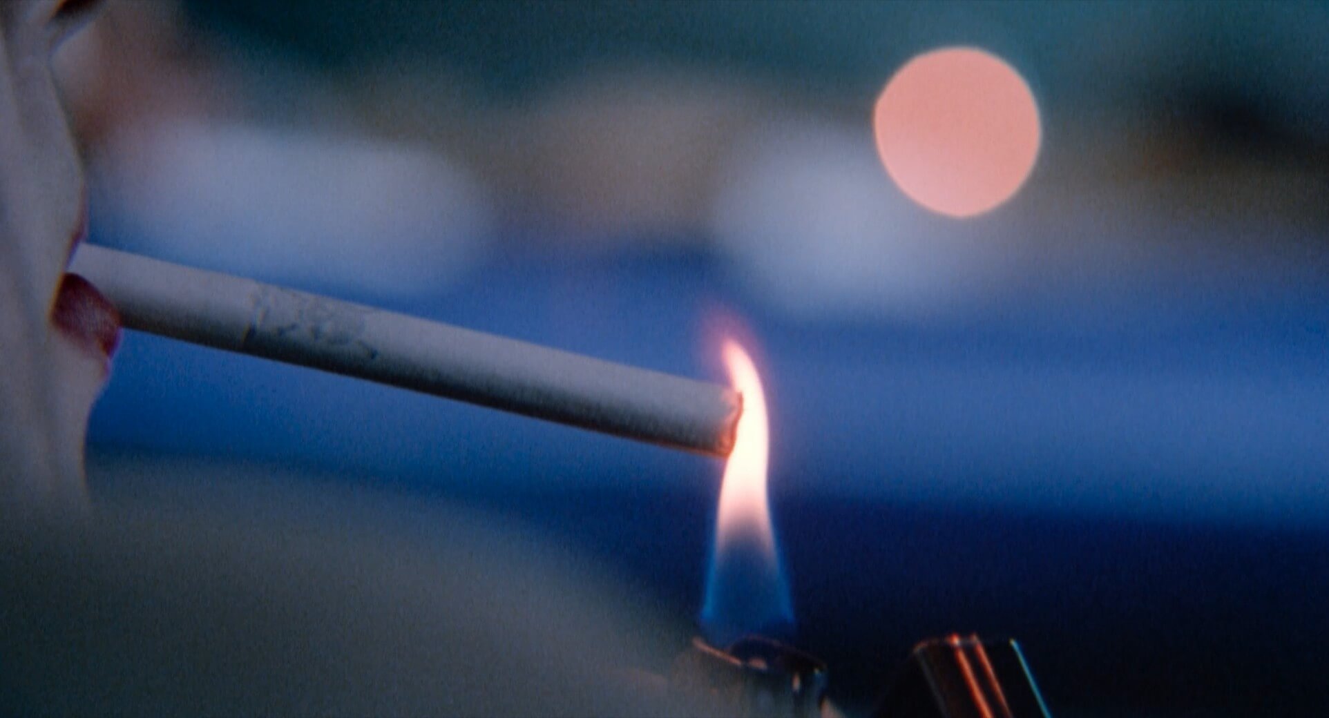 Extreme Close Up Shot Example ECU of lighting a cigarete from The Doom Generation