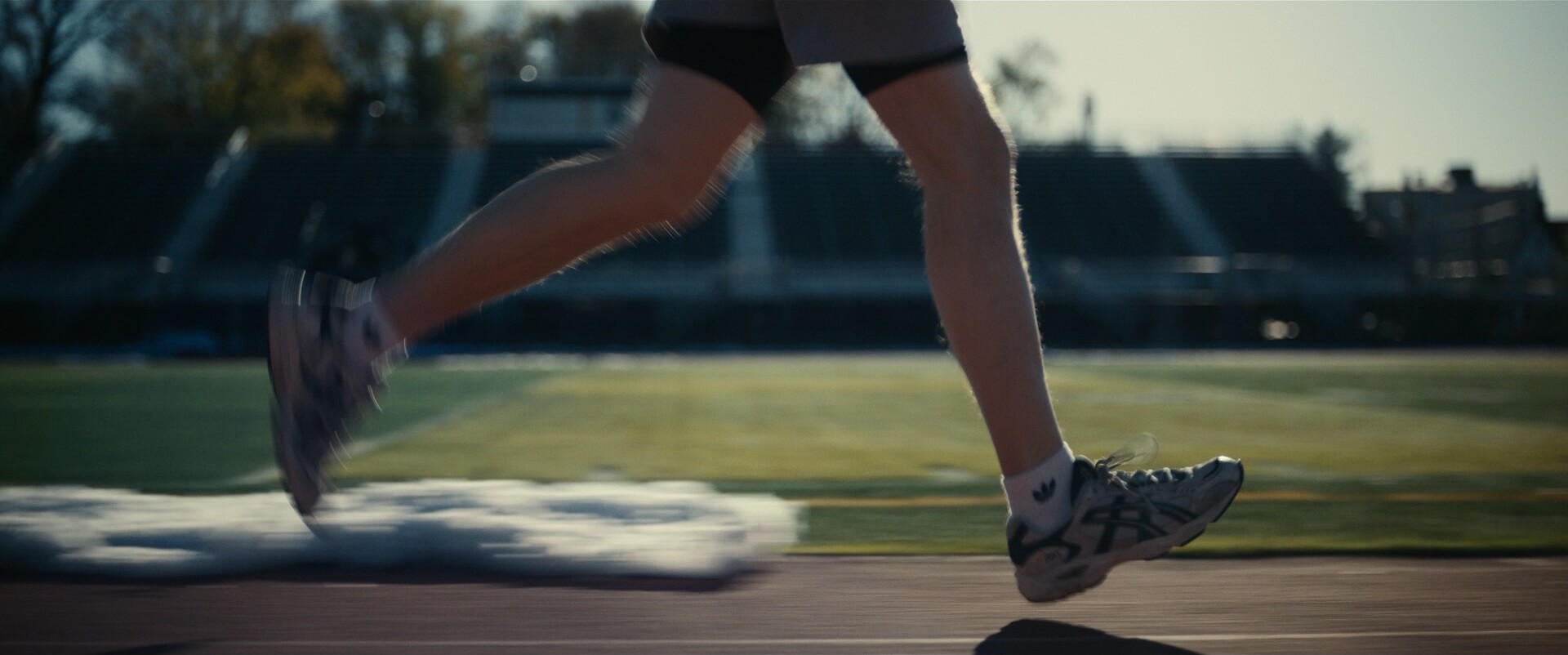 Knee Level Shot Example Knee level camera angle on running person from Dumb Money