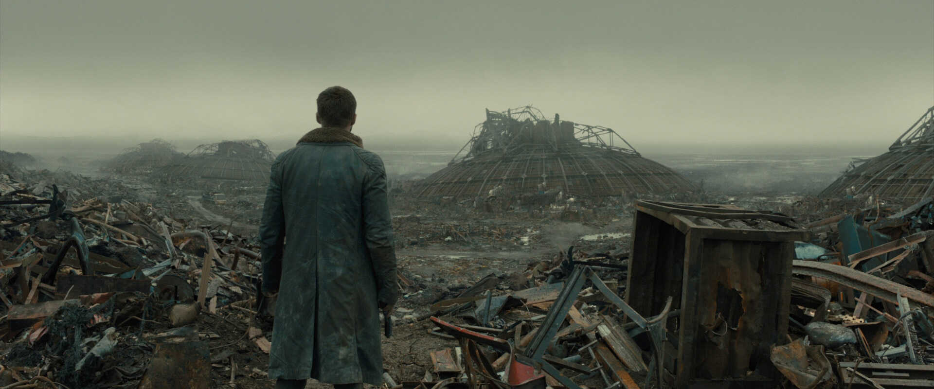Medium Full Shot Example MFS of Ryan Gosling looking at a trash pile from Blade Runner