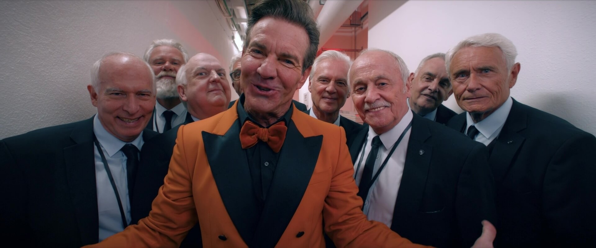 Medium Shot Example MS of Dennis Quaid and a group of people from The Substance