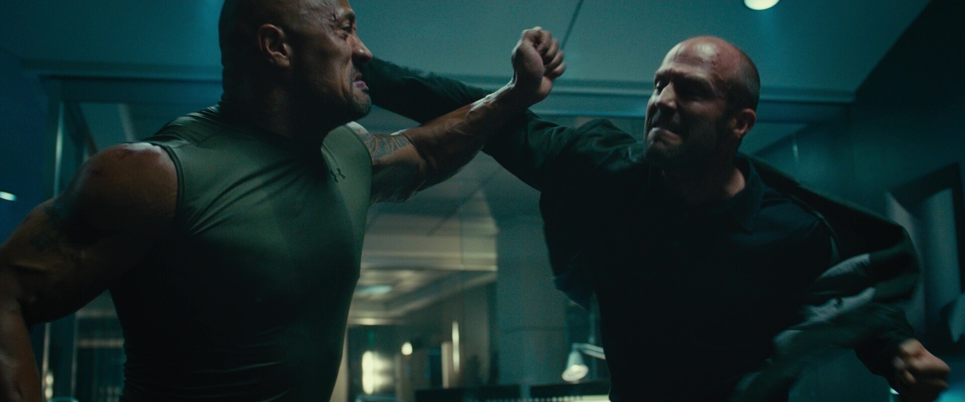 Medium Shot Example MS of Jason Statham and Dwayne Johnson fighting from Furious