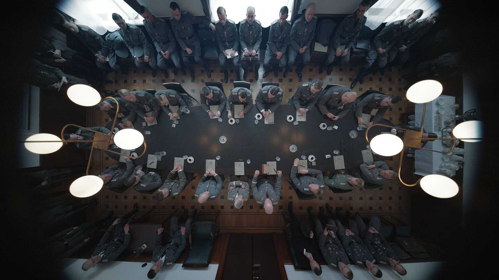 Overhead Angle Shot Example Overhead camera angle group of people sitting at a table from The Zone of Interest