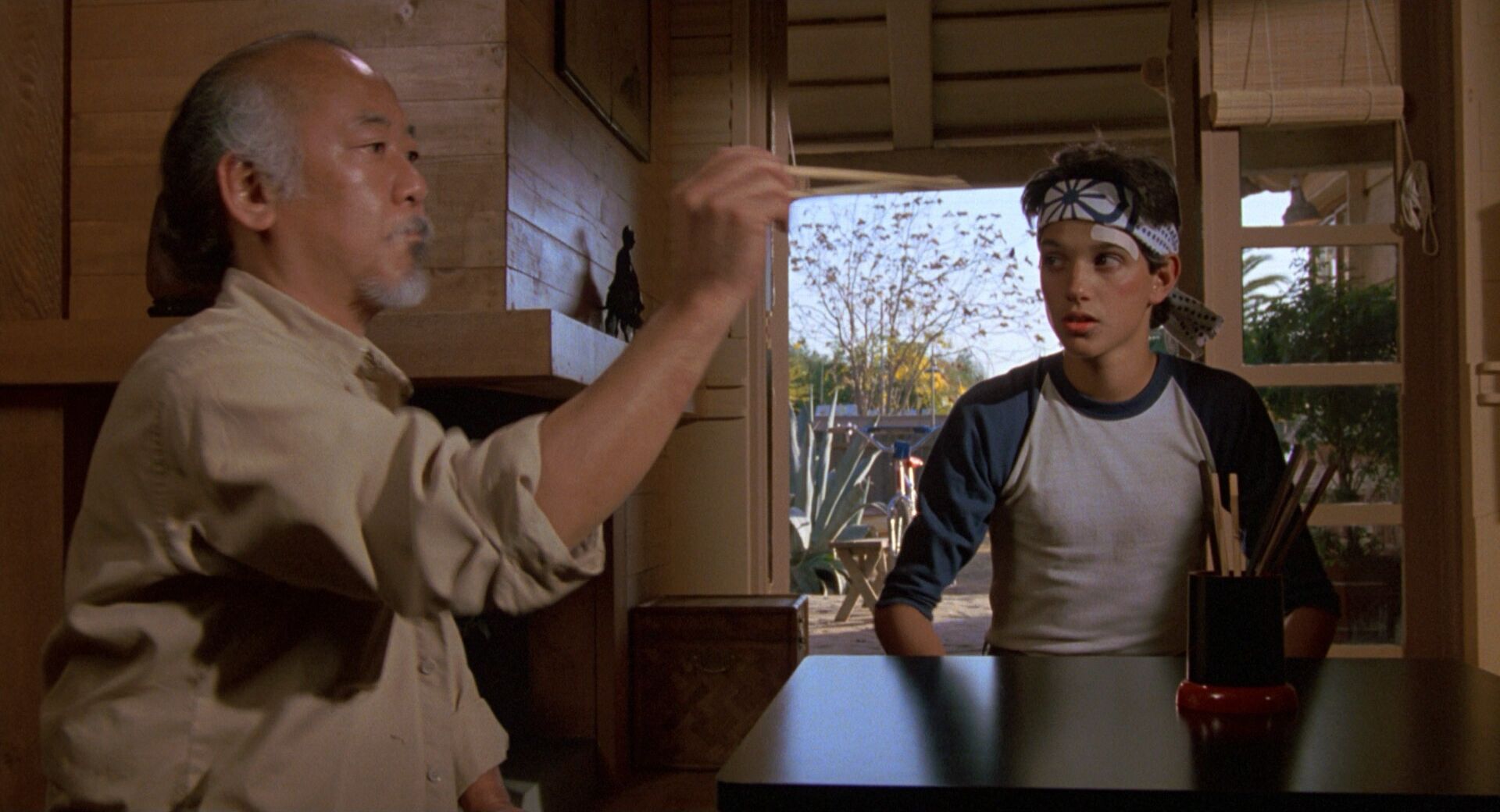 Shoulder Level Shot Example Shoulder level camera angle on Pat Morita from The Karate Kid