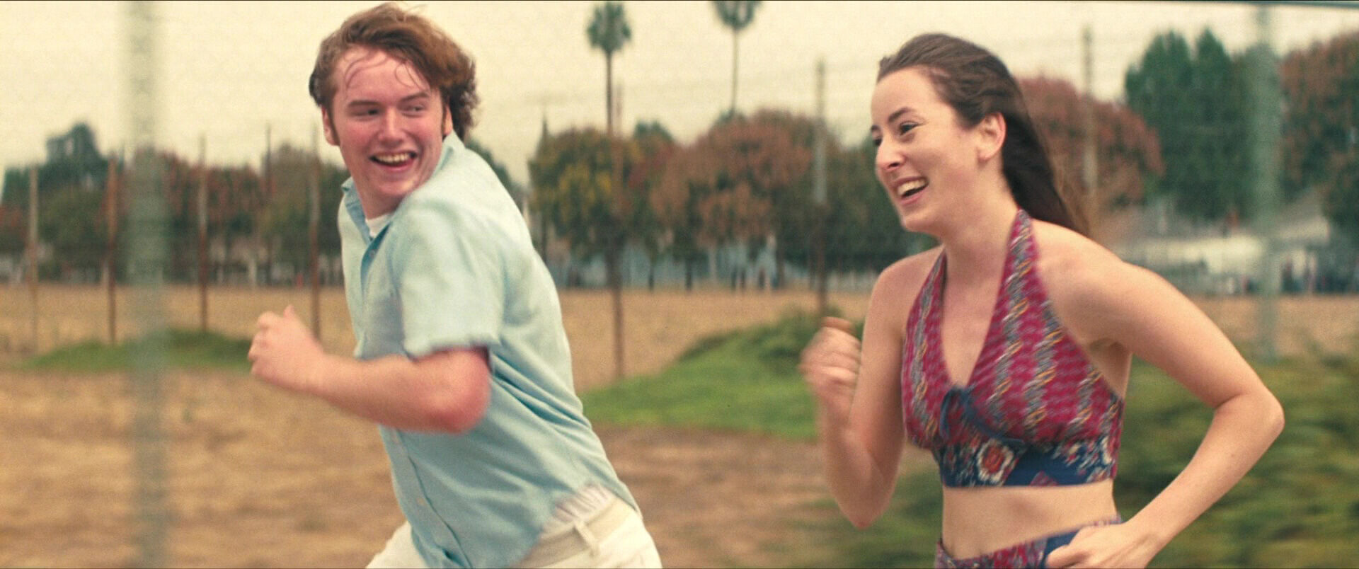 Trucking Shot Example Trucking Shot of Alana Haim and Cooper Hoffman from Licorice Pizza